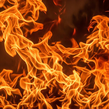 Fiery Orange and Red Flames on Black Background with Intense Heat, Glowing Light and Abstract Burning Fire Texture for a Dramatic Energy Design