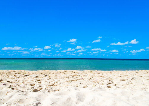 White tropical beach in Maldives with few palm trees and blue lagoon