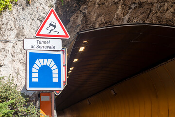 Naklejka premium Illuminated underground highway tunnel in Monaco where car races take place with road signs