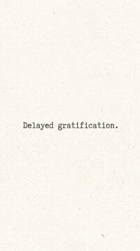 Vintage typewriter text delayed gratification, minimalist psychological concept on textured paper, inspirational quote for self-discipline
