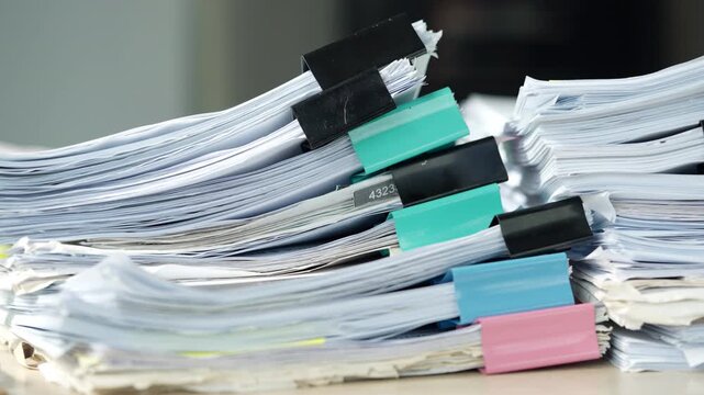 Stacks of Legal Documents and Case Files Organized on Office Desk
