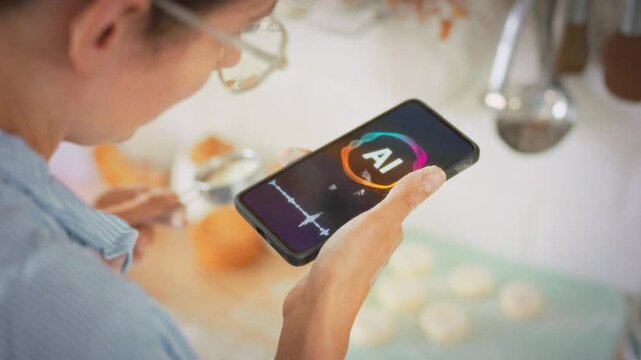 A woman in the kitchen prepares cottage cheese pancakes using flour and fresh dairy products lying on the counter. She uses an AI voice assistant to help her prepare them correctly