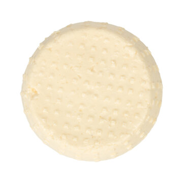 Round, textured cheese wheel with a smooth surface, showcasing a pale yellow color and a dotted pattern, isolated on a white background for culinary presentation