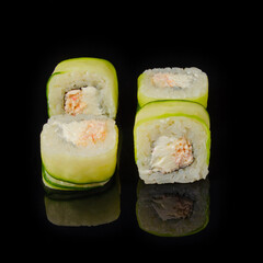 Fresh Cucumber Wrapped Sushi Rolls with Cream Cheese and Crab on Black Background © Дмитрий Ульянов