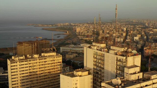 Drone Shot of Dakar Dense Overpopulated City Centre with Skyscrapers and Coastal Skyline in Senegal