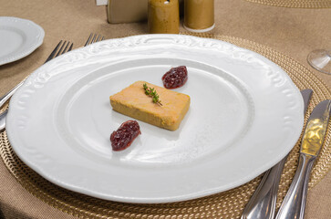 Foie Gras Terrine with Berry Jam and Thyme on White Plate © Дмитрий Ульянов