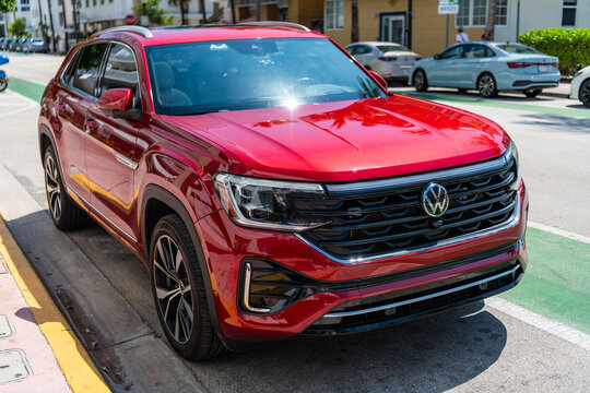 Miami, Florida, USA - May 13, 2025: Volkswagen Atlas or Atlas Cross Sport 2024 crossover SUV car. Luxury crossover car Volkswagen Atlas. Car Volkswagen Atlas parked outdoor. Red car, corner view
