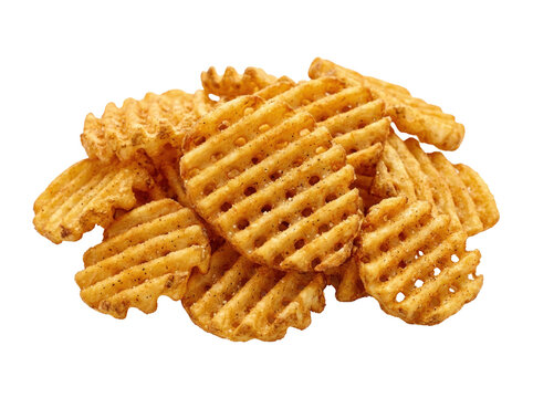 Crispy golden waffle cut potato chips piled high on a white background.