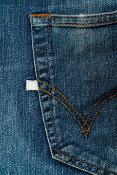Blue jeans back pocket close up