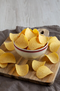 Crispy Cheese and Onion Flavoured Potato Chips in a Bowl, side view.