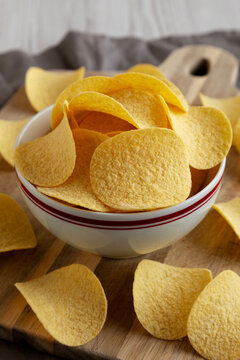Crispy Cheese and Onion Flavoured Potato Chips in a Bowl, side view.