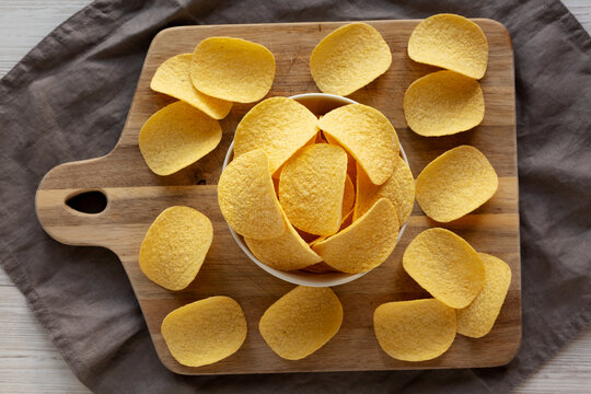 Crispy Cheese and Onion Flavoured Potato Chips in a Bowl, top view.