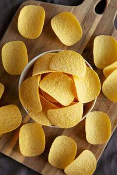 Crispy Cheese and Onion Flavoured Potato Chips in a Bowl, top view.
