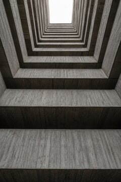 Brutalist concrete balconies stacked and seen from directly below