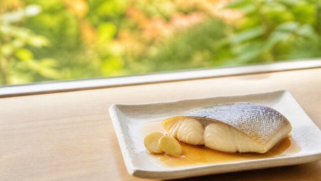粉引の角皿に盛った白身魚の煮付け 生姜を添えた秋の和食