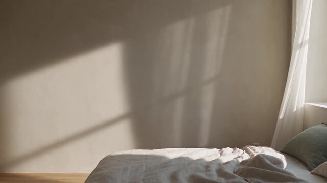 Sunlit Linen Bedroom with Sheer Curtain Moving in Summer Breeze