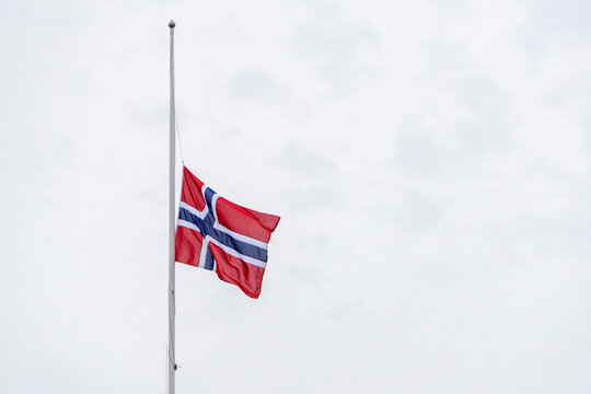 Norway flag flying at half mast honoring national mourning