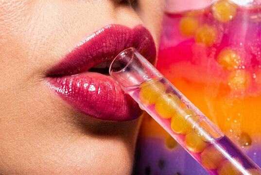 Woman Drinking Refreshing Bubble Tea with Straw Close Up
