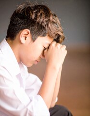 Fototapeta premium A contemplative teenage boy portrait , concept of reflective thinking