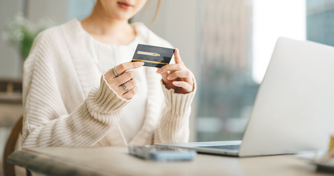 Asian woman using credit card using banking online payment digital technology currency wealthy financial
