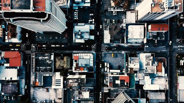 Top Down Drone View of Quito Ecuador City Blocks, Rooftops, Streets, High Rise Buildings and Dense Urban Architecture Pattern