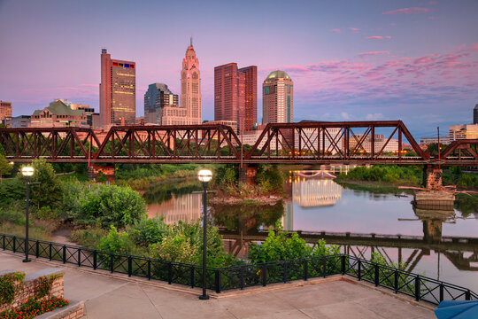 Columbus, Ohio, USA. Cityscape image of Columbus, Ohio, USA downtown skyline with the reflection of the city in the Scioto River at summer  sunset.