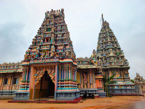 View of the colorful and ornate gopurams of the Pathirakali Amman Temple featuring intricate sculptures and vibrant architectural details in Trincomalee, Eastern Province, Sri Lanka.