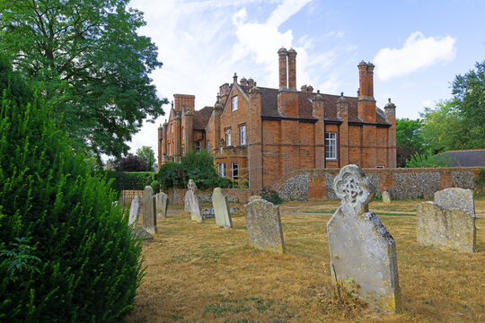 Graveyard view of The Holy and Blessed Trinity Hospital, in Long Melford.