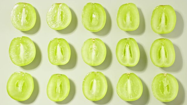 Fresh Green Grapes Sliced Halves Grid Pattern Moving Shadows Stop Motion Light Green Background Healthy Organic Summer Fruit Pop Art Commercial Video