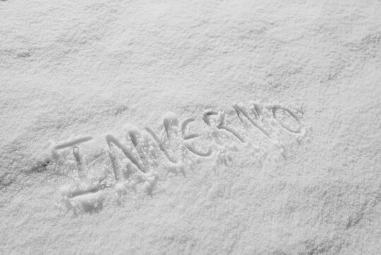 Handwritten message impressed into a fresh snow surface