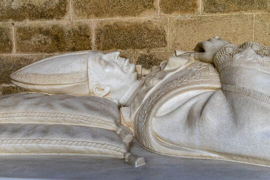 View of the marble effigy of a bishop resting on a tomb inside the Cathedral of Evora in Evora, Distrito de Evora, Portugal.