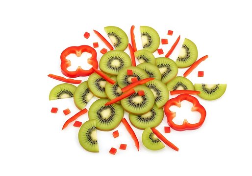 Sliced kiwi fruit with red juice splatter design