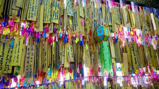 Wat Chedi Luang, Chiang Mai, Thailand, filled with colorful prayer wish plaques and handwritten messages, Buddhist faith, devotion, spirituality and Thai temple culture.