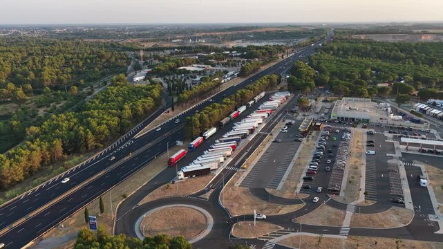 Villetelle, France - July 25, 2026: aerial view of the Fastned charging station at A9 Aire d'Ambrussum Nord service area with parking area and motorway infrastructure