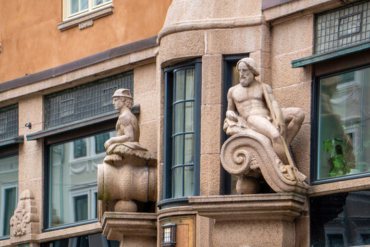 Oslo building facade with historical stone sculptures architecture