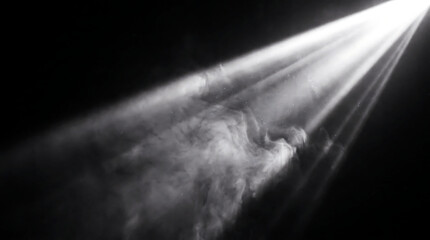 Obraz premium Bright white spotlight beams cutting through dense smoke on a dark stage