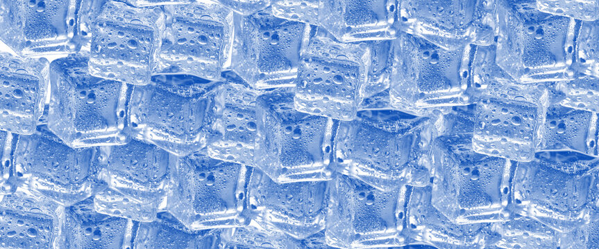 Background pattern of wet clear blue ice cubes covered in water droplets