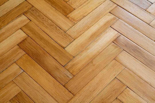 The Warm Wooden Herringbone Floor Pattern in Sunlit Modern Interior