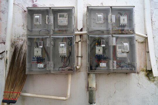 SHAOGUAN, CHINA - NOVEMBER 11, 2025: Electricity meters on a wall of an apartment building in Shaoguan (Guangdong Province), China.