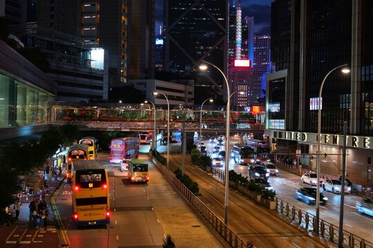 HONG KONG, CHINA - NOVEMBER 15, 2025: Double decker buses in night streets of Central, Hong Kong city.