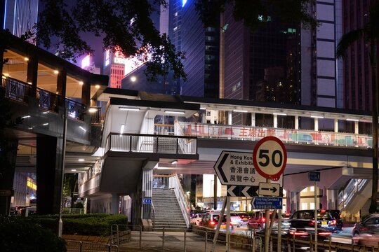 HONG KONG, CHINA - NOVEMBER 15, 2025: Car traffic in night streets of Central, Hong Kong city.