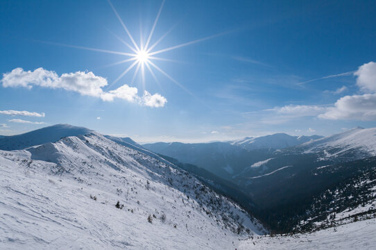 View of the snowy peaks of Dumbier mountain under a bright sun in the Low Tatras, Nizke Tatry, Zilina Region, Slovakia.