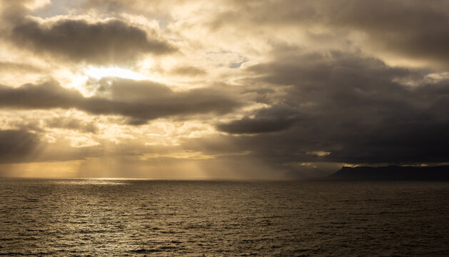 beautiful sunset and dusk light falling on the rocky coastline of DeKelders, South Africa