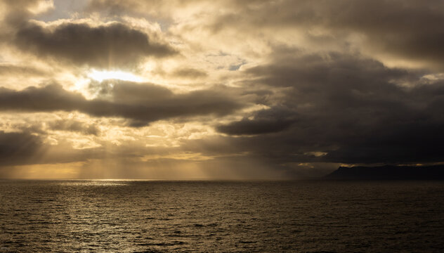 beautiful sunset and dusk light falling on the rocky coastline of DeKelders, South Africa