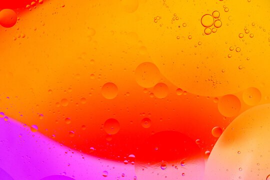 Abstract macro liquid background with colorful oil and water bubbles