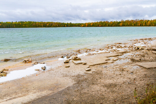 The wild stony shoreline of Lake Cyprus in the fall. Bruce Peninsula National Park in Ontario, Canada
