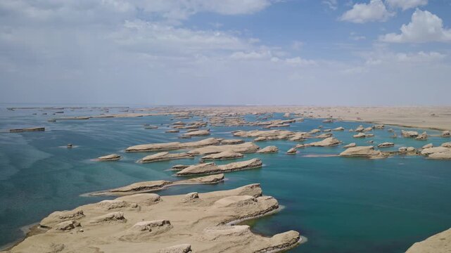 High-Angle Aerial View of Wusute Water Yadan West Sea Fleet in Qinghai: Wind-Eroded Rock Formations, West Xitai Jiner Lake, Blue Water and Qaidam Basin Gobi