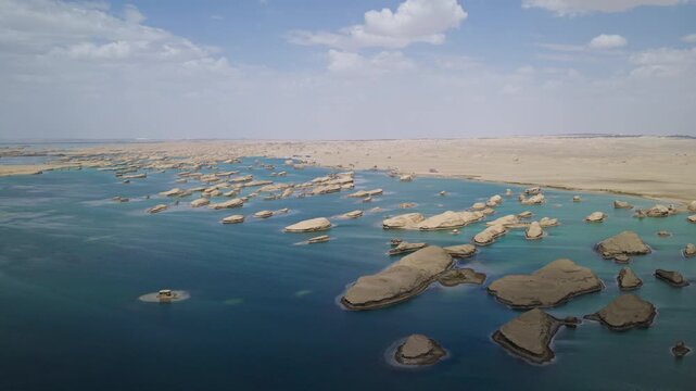 High-Angle Aerial View of Wusute Water Yadan West Sea Fleet in Qinghai: Wind-Eroded Rock Formations, West Xitai Jiner Lake, Blue Water and Qaidam Basin Gobi