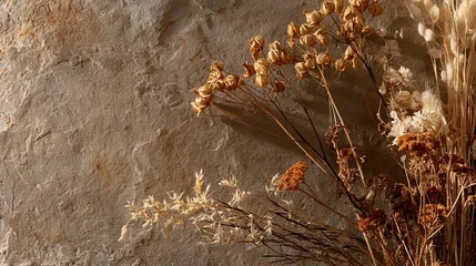 Rustic boho earth tone backdrop concept. Dried wildflowers and plants on a textured earthy background. © ANGEL4289