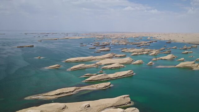 High-Angle Aerial View of Wusute Water Yadan West Sea Fleet in Qinghai: Wind-Eroded Rock Formations, West Xitai Jiner Lake, Blue Water and Qaidam Basin Gobi